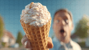 Man in Shock Holding a Strawberry Ice Cream Cone Close-Up