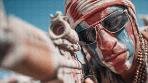 Masked Fighter with Patriotic Face Paint Aiming Down Scope