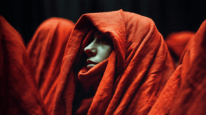 Side Profile of Woman Shrouded in Red Fabric