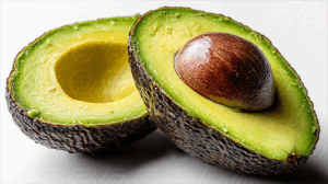 Fresh Sliced Avocado with Seed on White Background