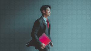 Confident Businessman Walking with Red Folder in Studio Light