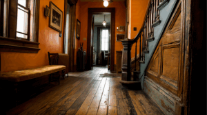 Vintage Hallway with Warm Lighting and Wood Staircase