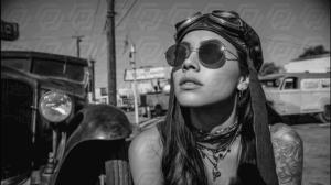 Black and White Retro Woman with Goggles by Vintage Car