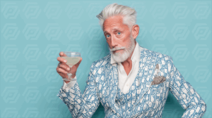 Stylish Elderly Man Holding Cocktail in Patterned Suit Against Blue Background