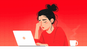 Stressed Female Freelancer Rubbing Eyes at Laptop