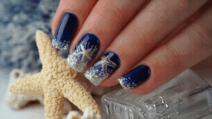 Dark Blue Glitter Nail Art With Silver Starfish Accents