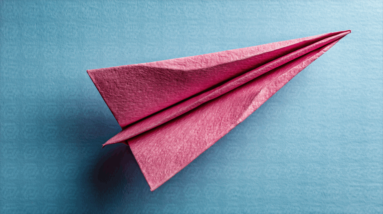 Pink Paper Airplane On Blue Background