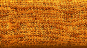 Close-Up View Of Orange Burlap Fabric Texture