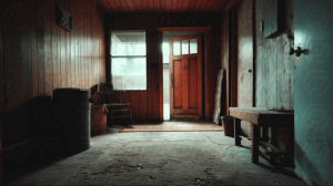 Rustic Mudroom With Open Door and Vintage Decor