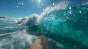 Surfboard POV Riding a Crystal Clear Blue Wave