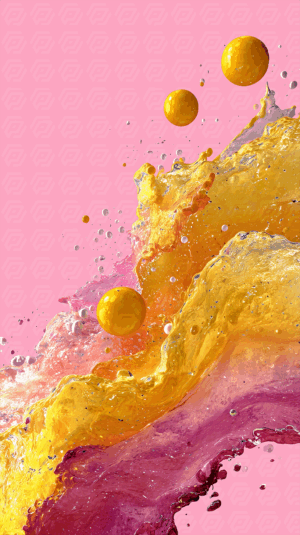 Vibrant Splash of Yellow and Pink Liquid Against a Soft Pink Background